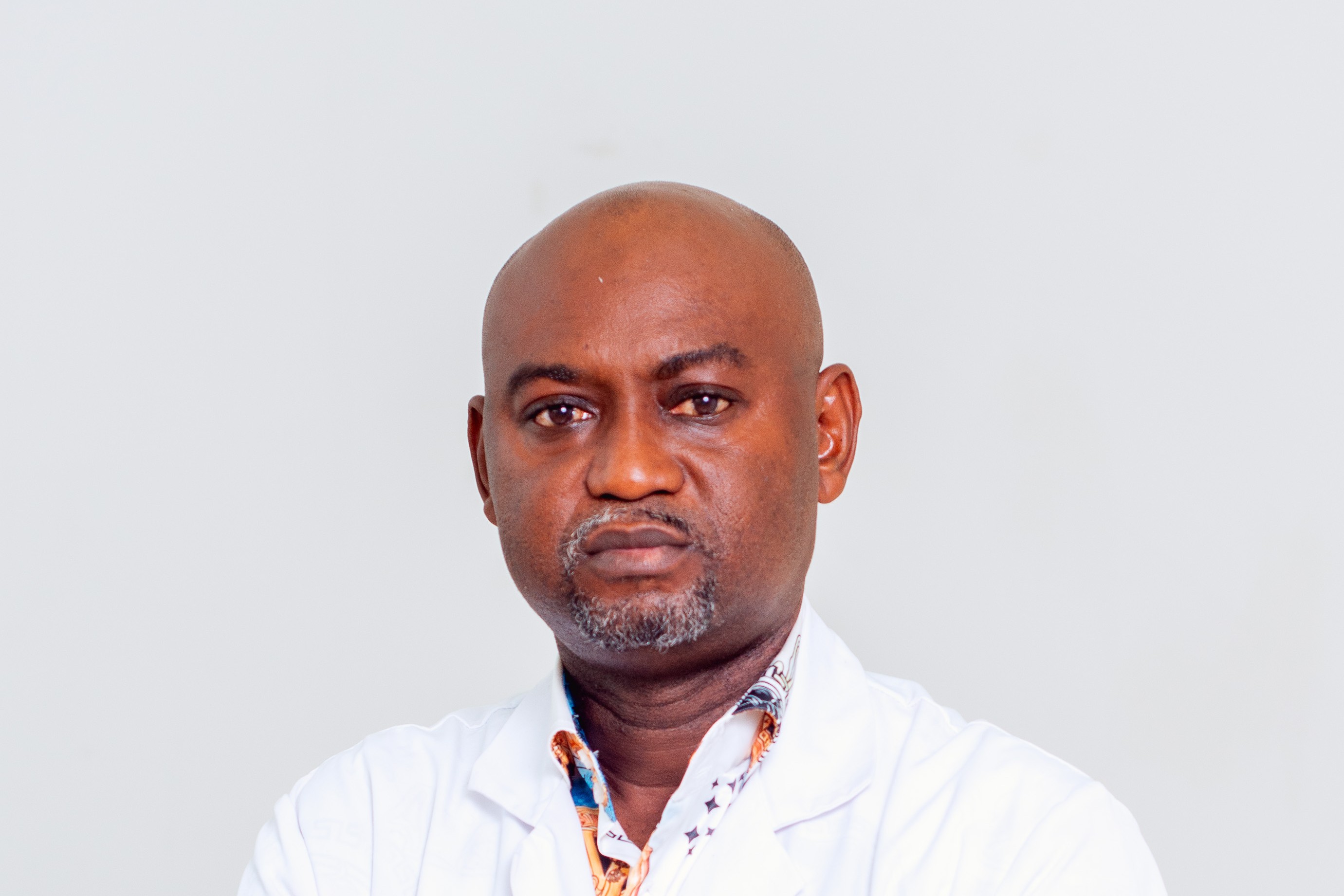 Dr. ROBERT MAGUNDU